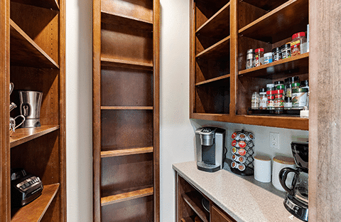 Fully stocked pantry with coffee maker, spices, and essentials at Mansion on the Lake in Newton, WI, ideal for family and group stays