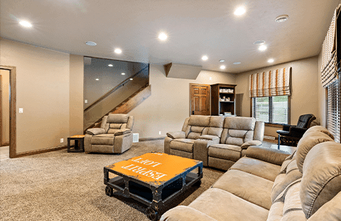 Family room with toys, games, and ample seating for multifamily gatherings at Mansion on the Lake in Newton, WI