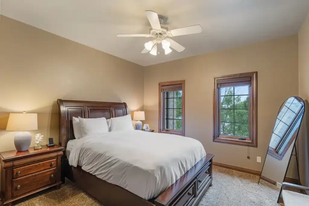 Erie Elegance room at Mansion on the Lake with queen-size bed, large closet, full-size mirror, and cell phone charging station, offering classic style and comfort