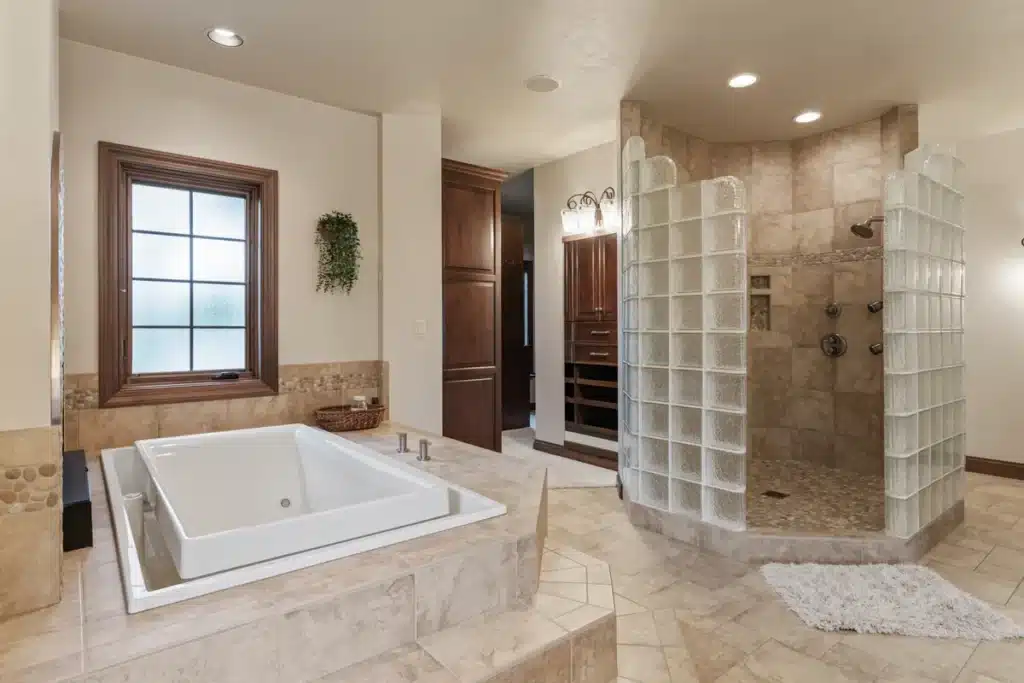 Luxurious bathtub and spacious closet in the Lakeside Retreat bathroom at Mansion on the Lake