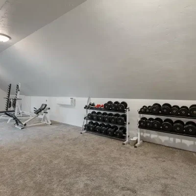 Workout room at Mansion on the Lake featuring a full set of free weights, dumbbells, and weight racks