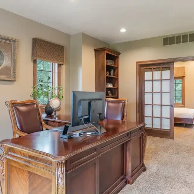 Large executive office at Mansion on the Lake with Lake Michigan view and computer screen for laptop connectivity