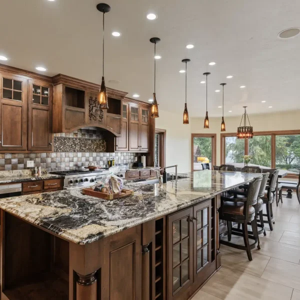 Gourmet kitchen with Wolf appliances, marble countertops, and chef’s tools at Mansion on the Lake in Newton, WI